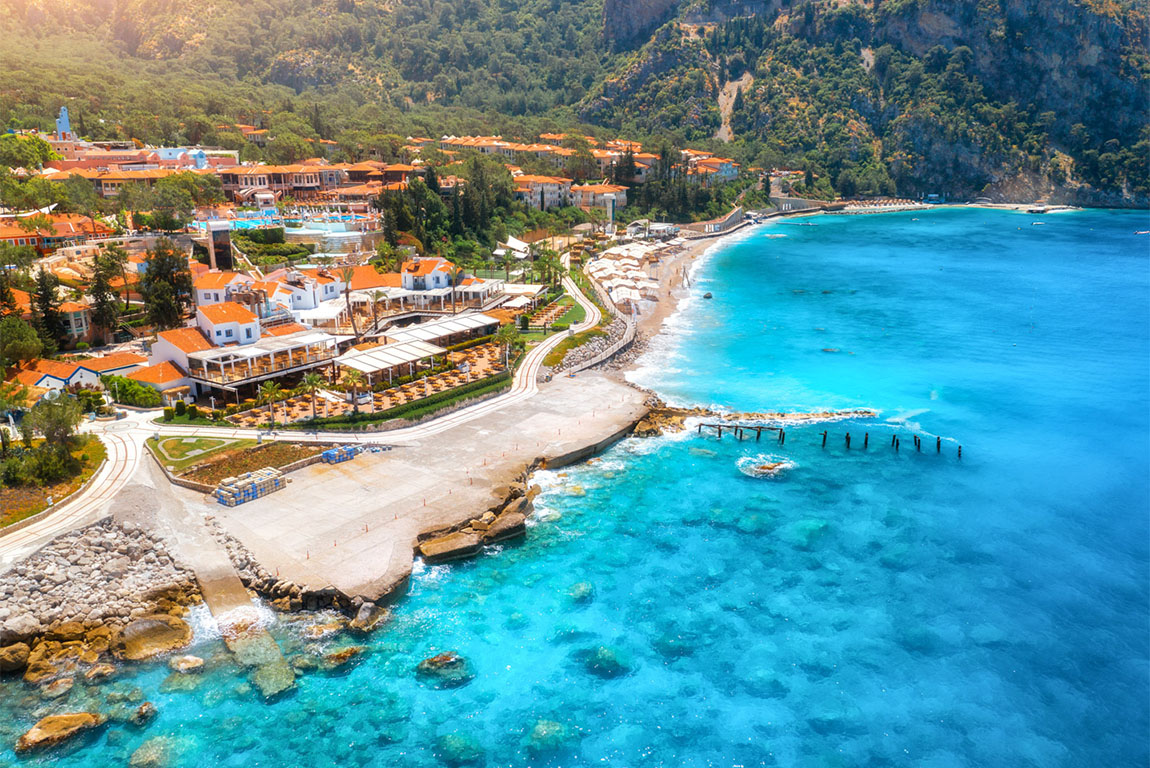 Paragliding into the sunset over the ocean