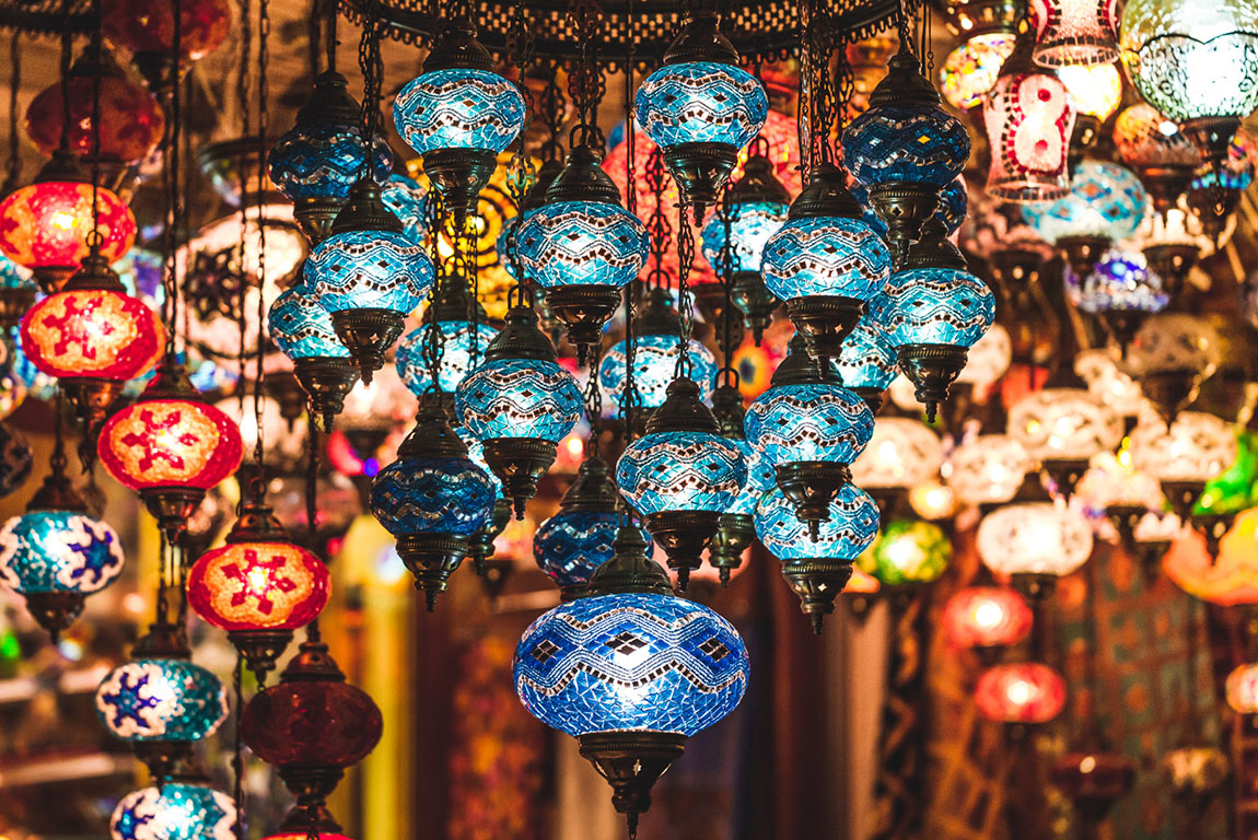 Cute cat sits on a table in small cafe in Uçhisar Castle